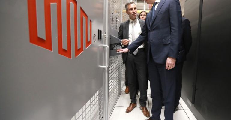 French economy minister Bruno Le Maire (R) is guided by Regis Castagne, managing director of Southern European Equinix Data Center, during the inauguration of the Paris data center called PA8 in the northern Parisian suburb of Pantin in February 2019.